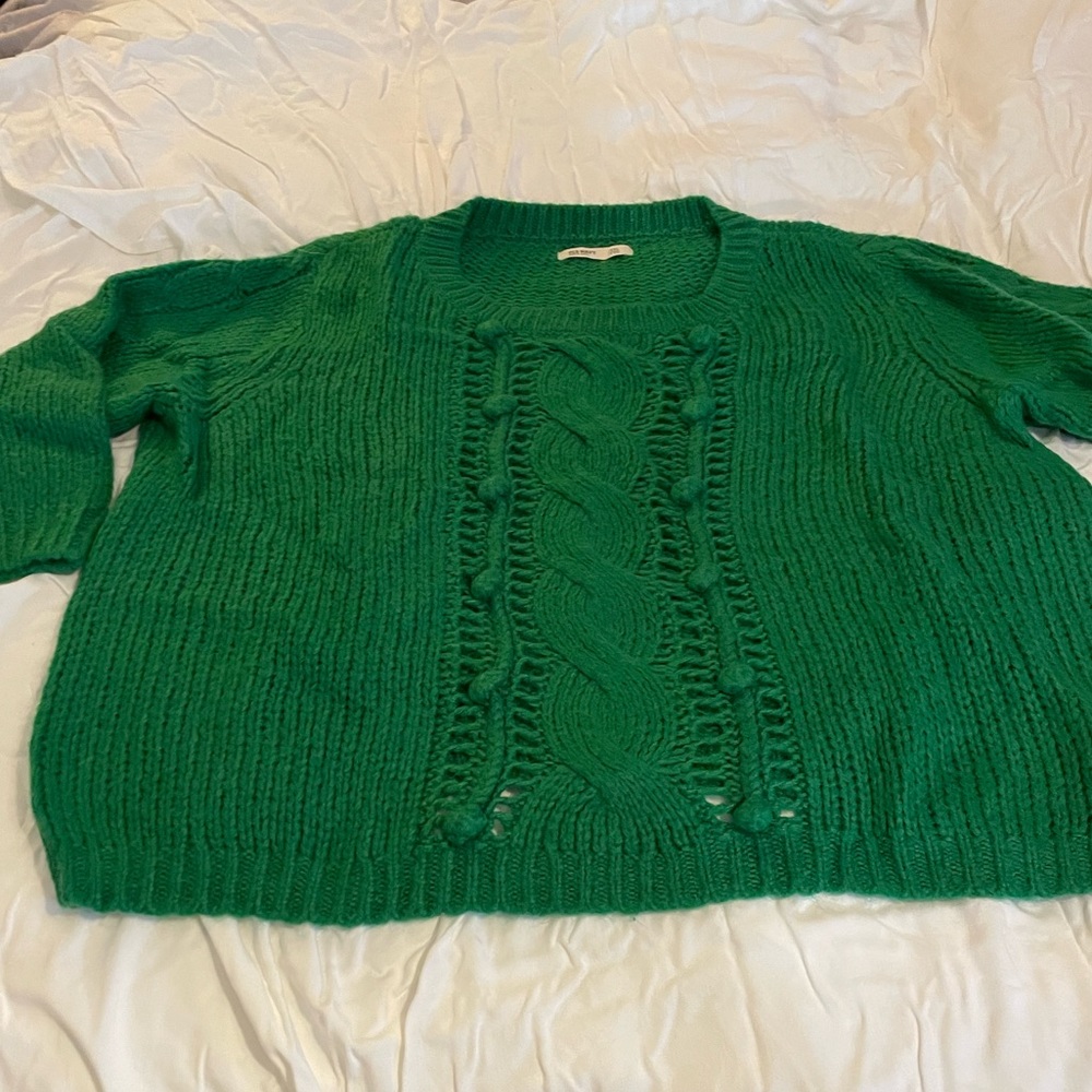 Green cable knit sweater.